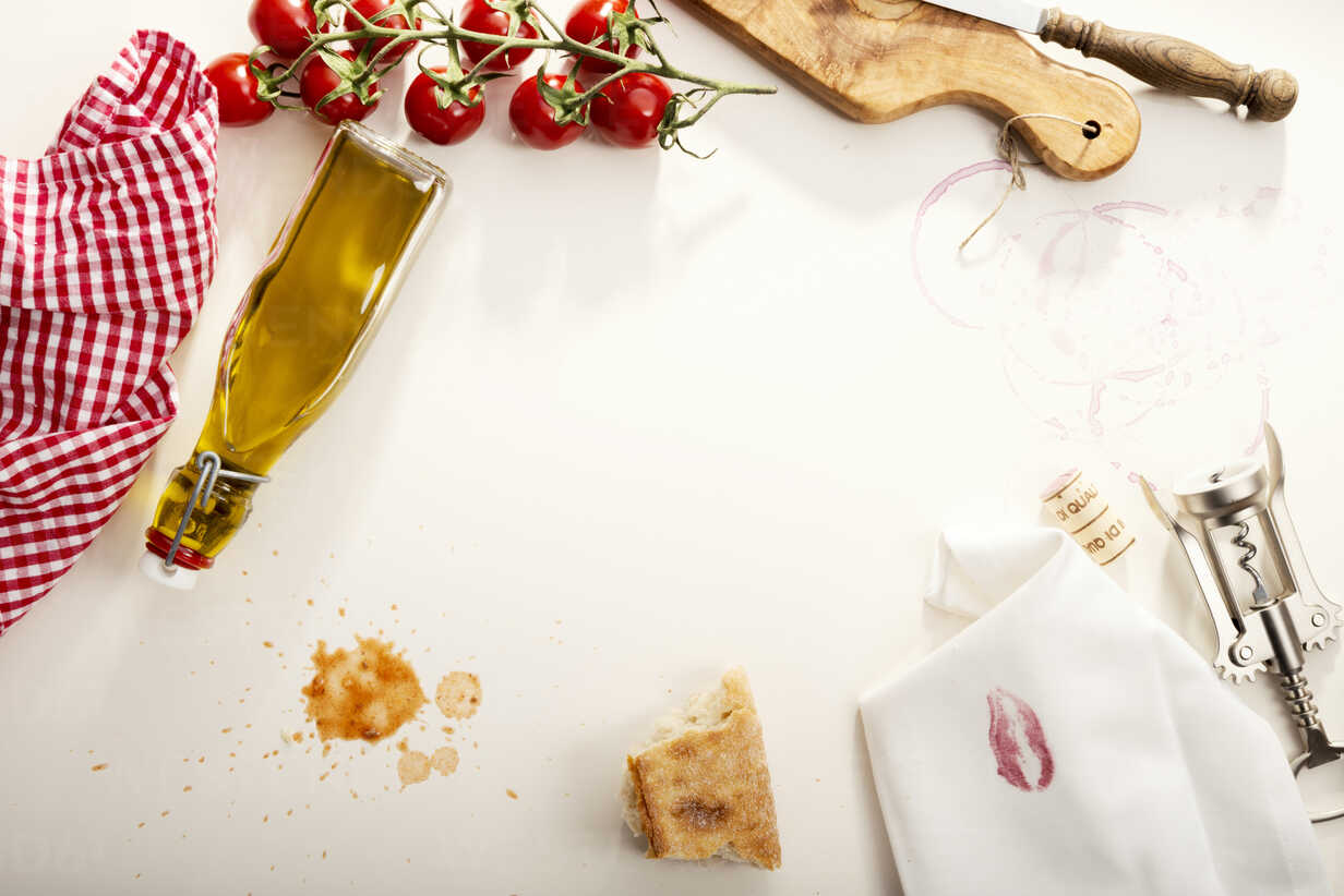 Italian Food Olive Oil Bottle Baguette Napkin With Lipstick Corkscrew And Tomatoes Stockphoto