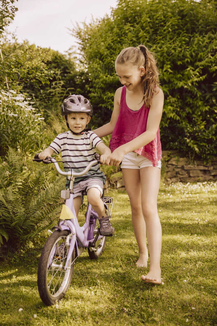 little boy riding bicycle