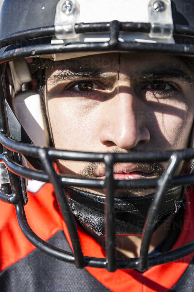 Close Up Portrait Of American Football Player With Helmet Stockphoto