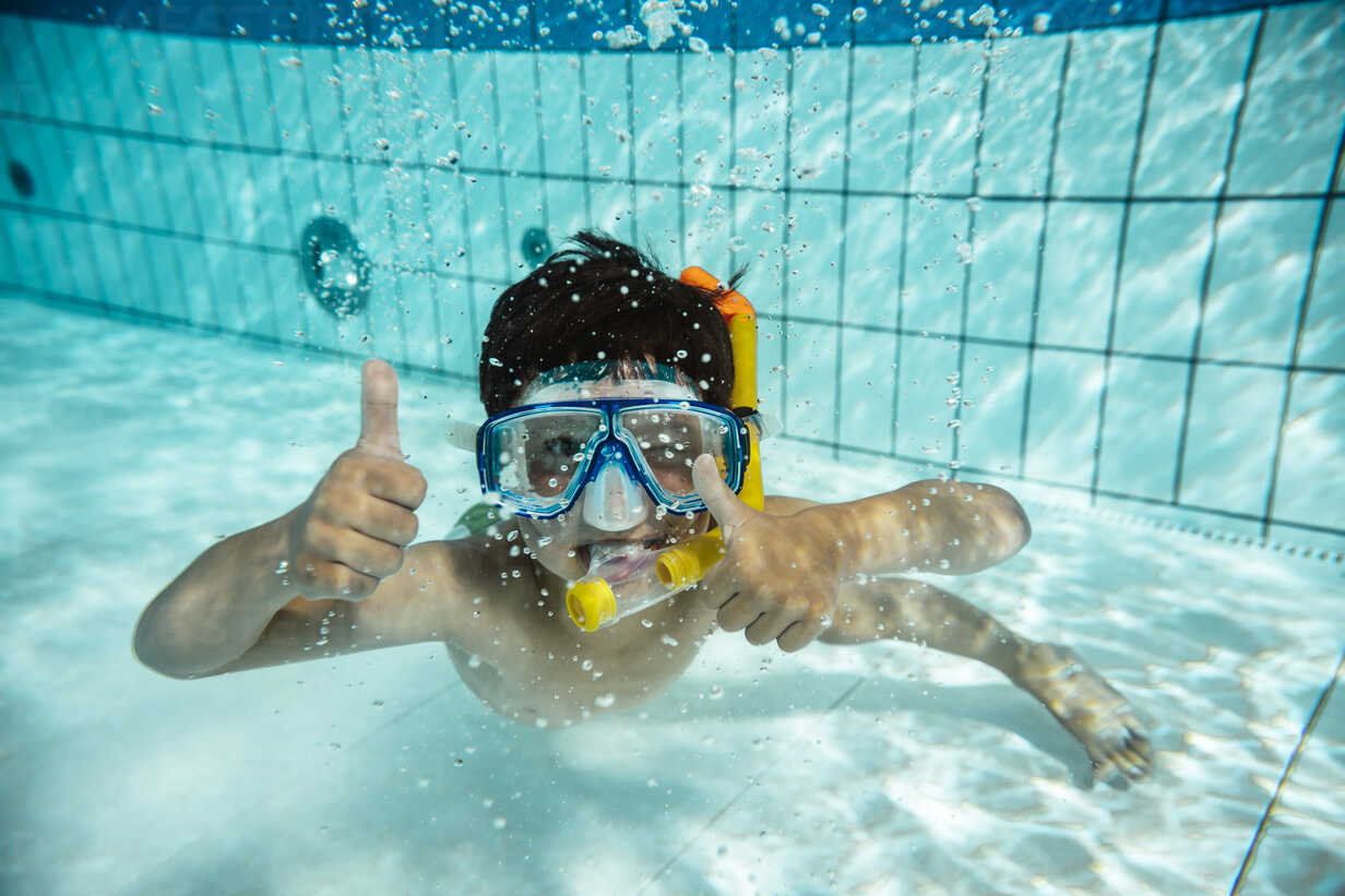 boy with diving goggles and snorkel under water in swimming pool MFF04179