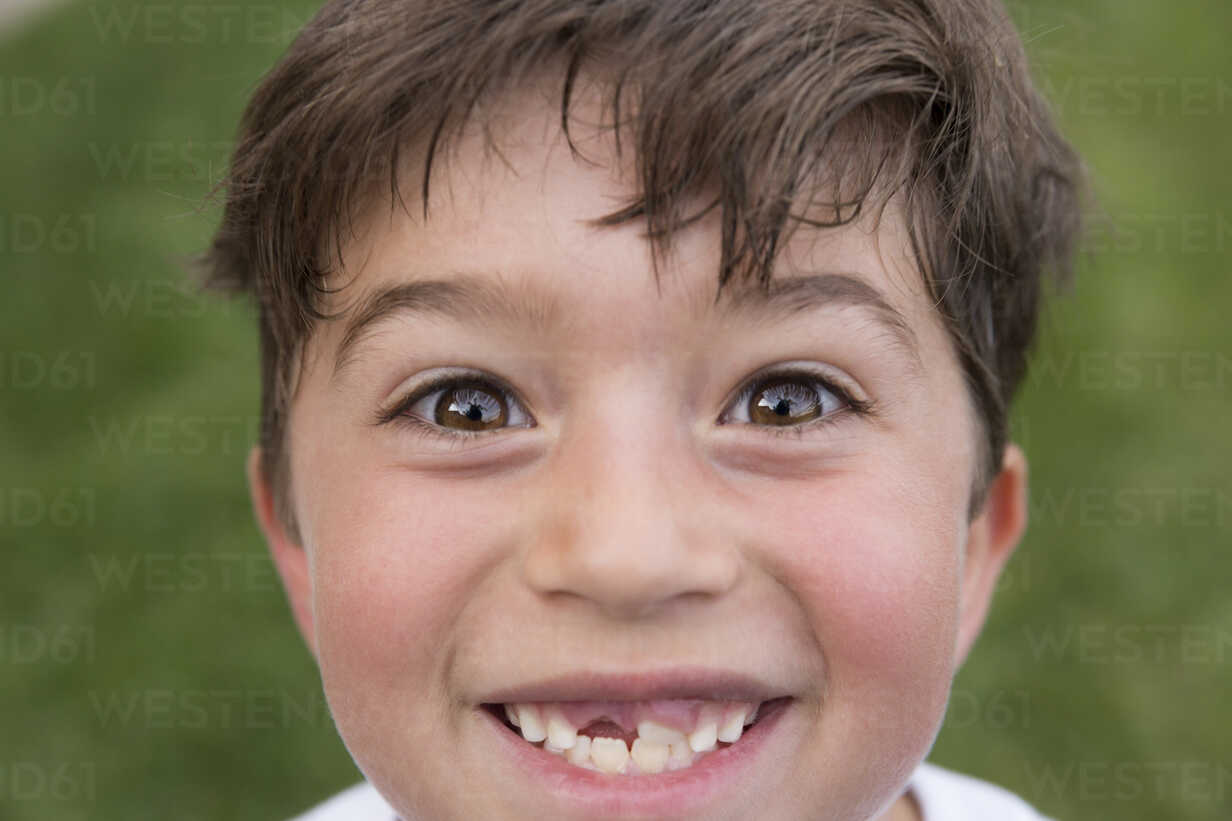 Portrait Of Young Boy Smiling Showing Gap From Lost Tooth ISF13076