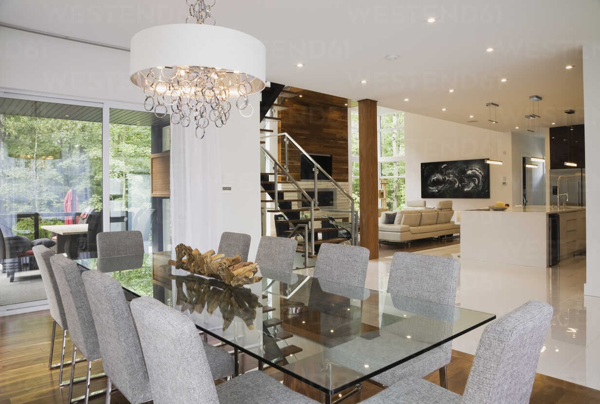 Modern Interior Design Luxury Open Plan Dining Room With Glass Dining Table And Grey Upholstered Dining