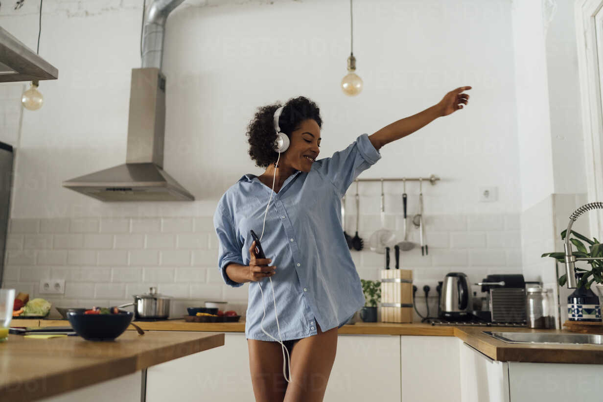 Woman Dancing And Listening Music In The Morning In Her Kitchen Boyf01044 Boy Westend61