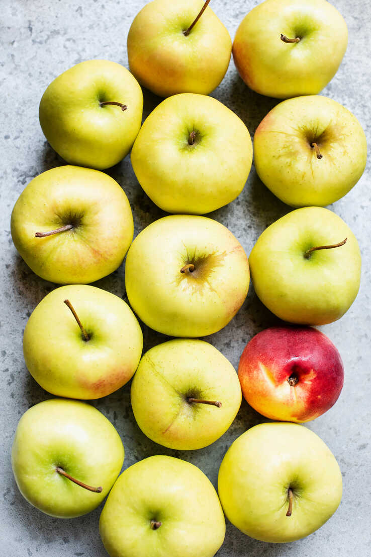 Golden Apples And One Peach Stockphoto