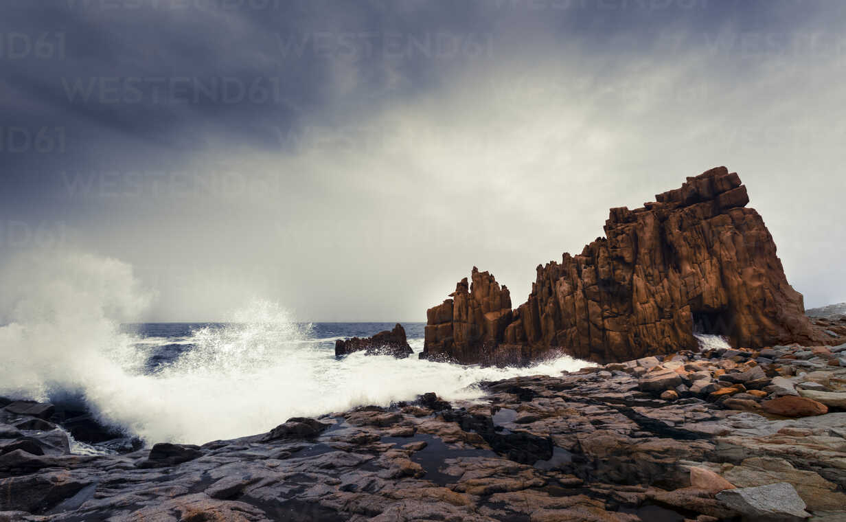 Italy Sardinia Tortoli Arbatax Rocks In The Surf Stockphoto