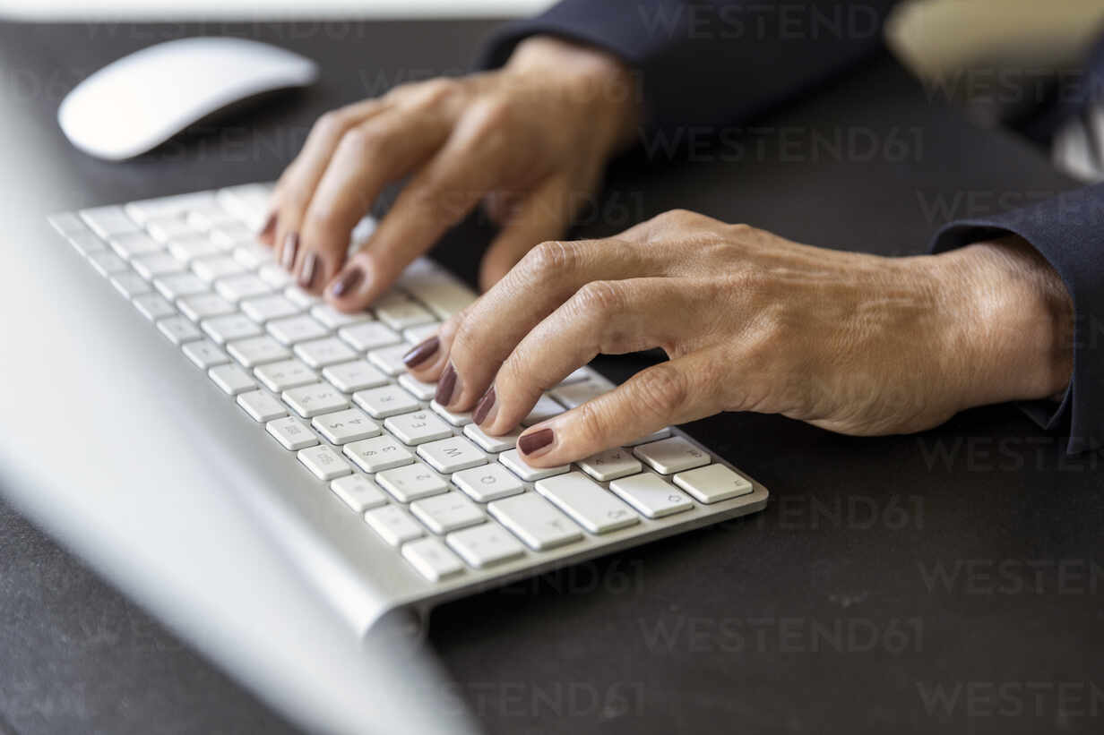 Woman S Hands On Computer Keyboard Close Up Stockphoto