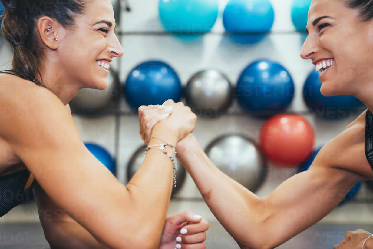 Happy Female Twins In Good Shape Doing Arm Wrestling Challenge In A Gym Jcmf00268 Jose Luis Arm wrestling is a type of athletic contest. https www westend61 de en imageview jcmf00268 happy female twins in good shape doing arm wrestling challenge in a gym