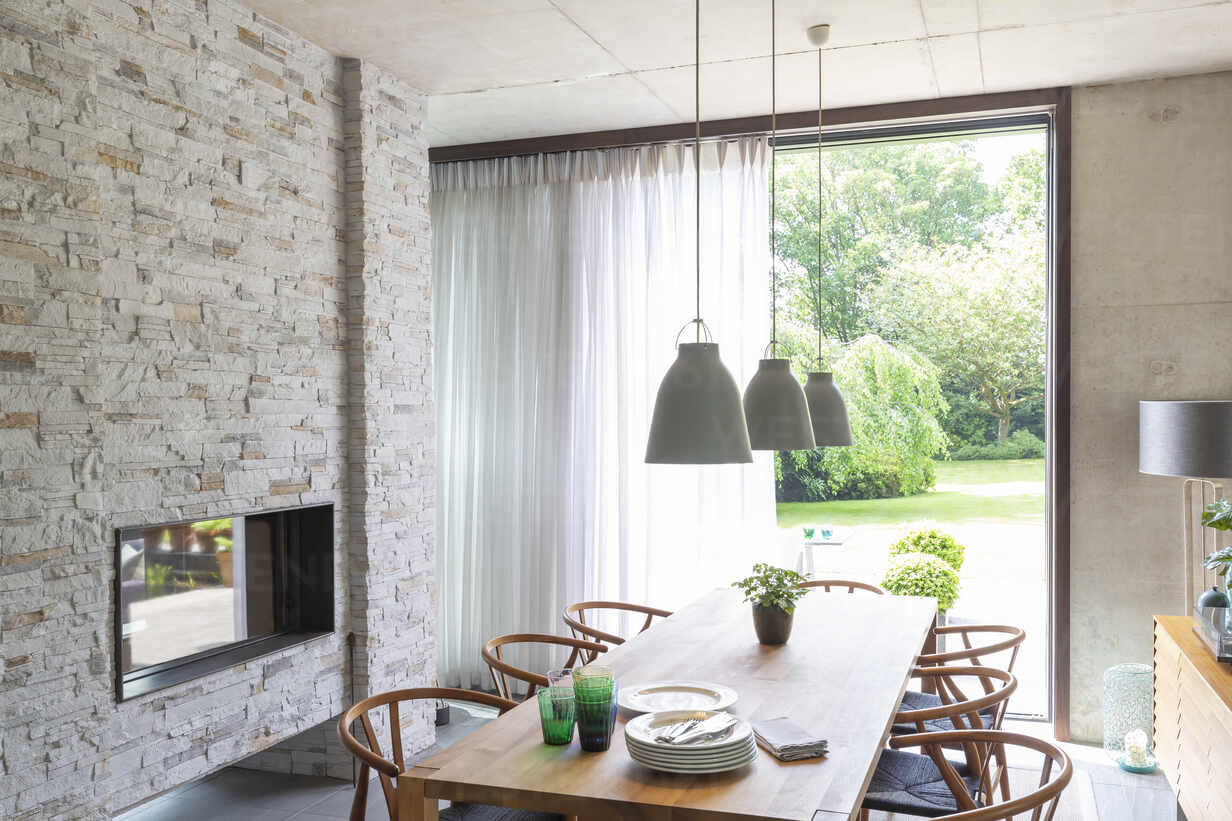 Pendant Lights Over Dining Table In Modern Dining Room With Brick Fireplace Caif24689 Charlie Dean Westend61