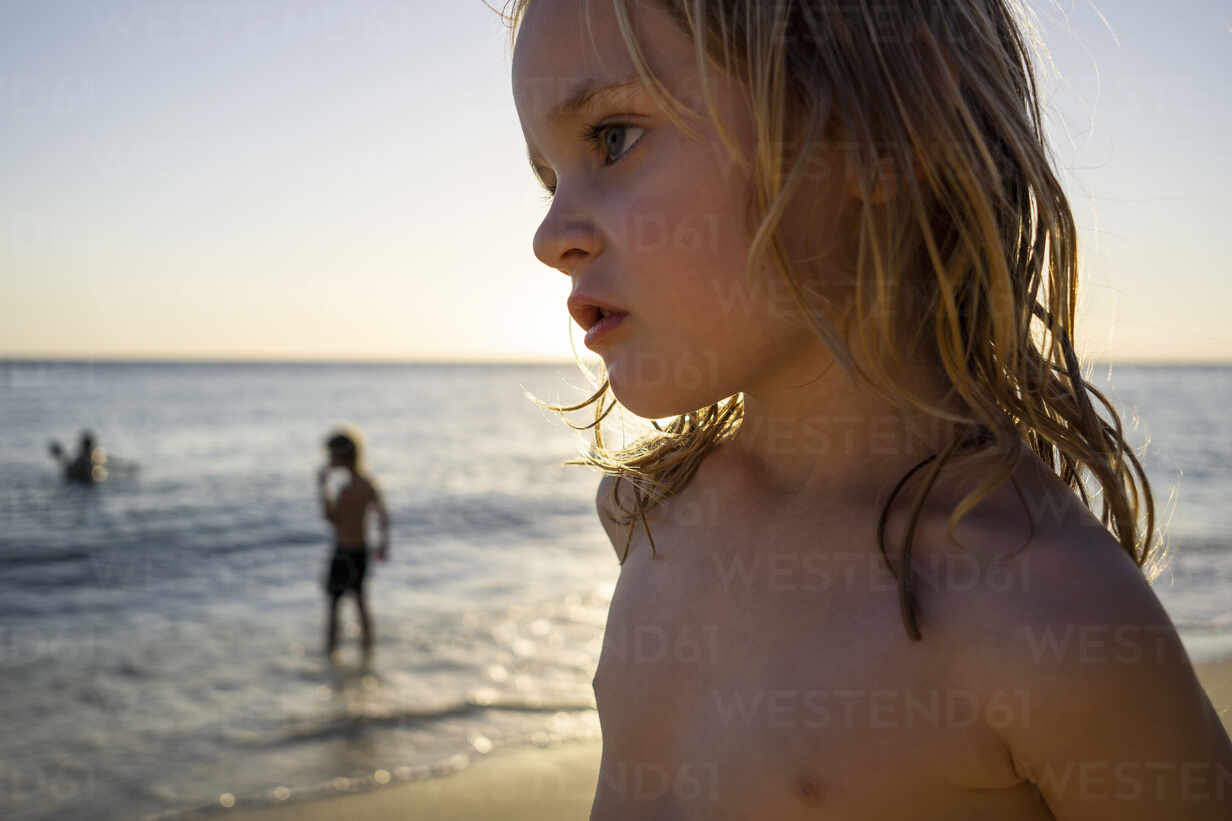Portrait Of Serious Little Girl On The Beach At Sunset Willemstad Curacao Jlof Johanna Lohr Westend61