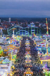 Germany Bavaria Munich Drone View Of Crowds Of People Celebrating Oktoberfest In Vast Amusement Park At Dusk Mmaf01351 Michael Malorny Westend61