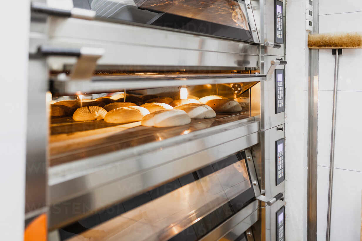 Bread baking bread in oven at commercial kitchen MRRF00168 Manu