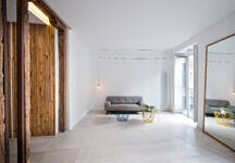 Simple Interior Of Modern Living Room With Wooden Doors And White Walls Stockphoto