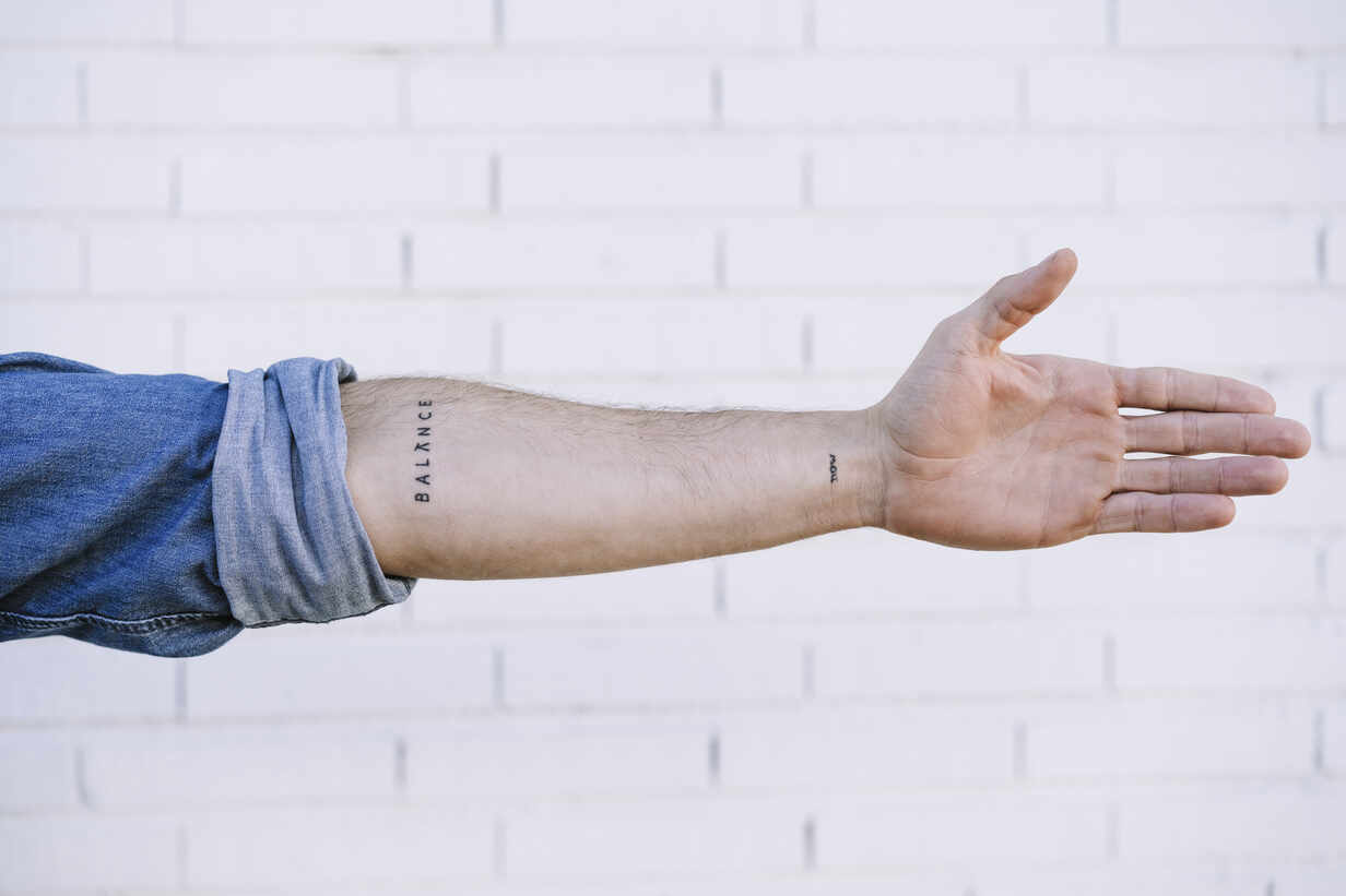 Man S Hand With Tattoo Against Brick Wall Ebbf Eva Blanco Westend61